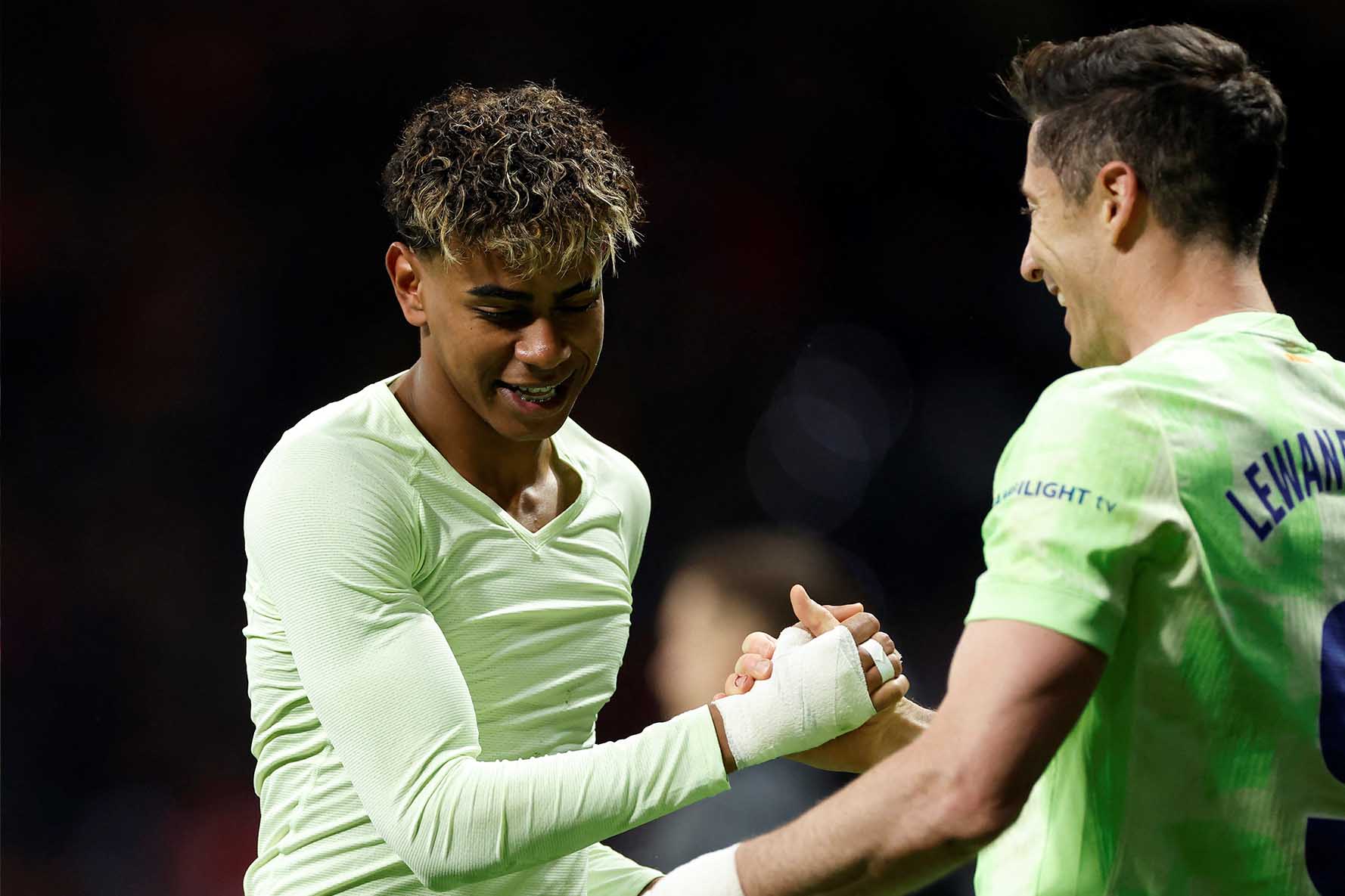 Robert Lewandowski và Lamine Yamal đang là những đầu tàu trên hàng công của Barcelona. Ảnh: AFP